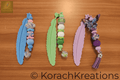Overhead flat lay of 3 beaded bookmarks arranged side by side on a warm wooden library counter, all beads and tassel designs clearly visible